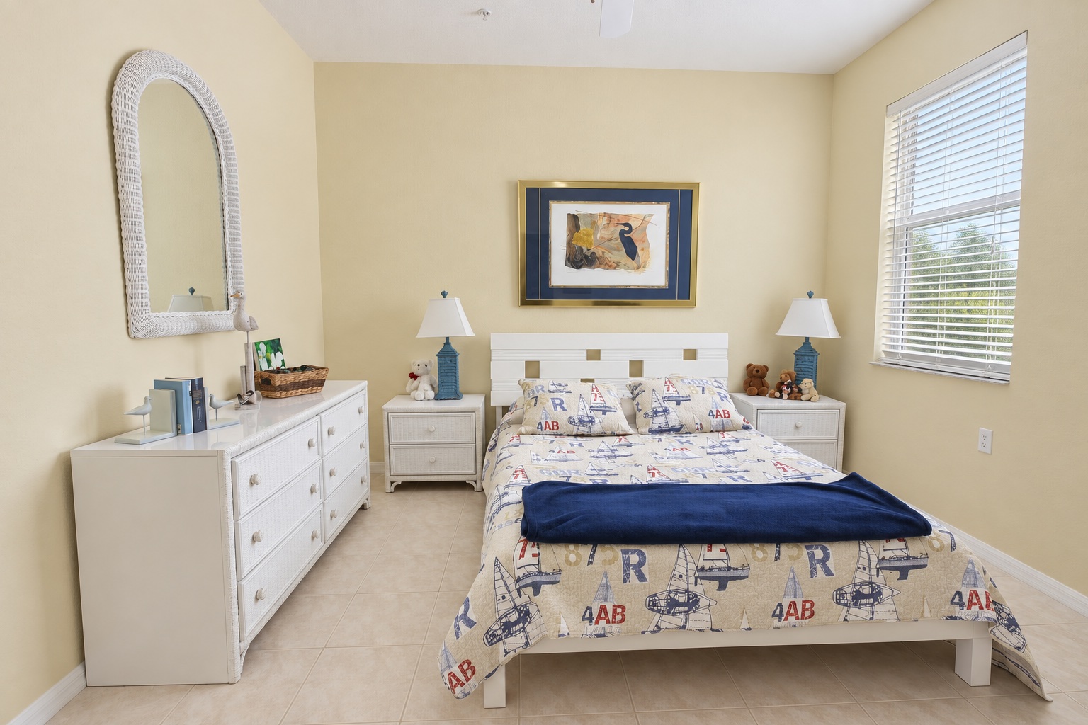 Second view of the guest bedroom with dresser, mirror and window